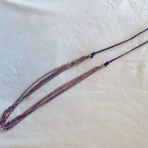 Fossil rose gold long necklace on leather strap.